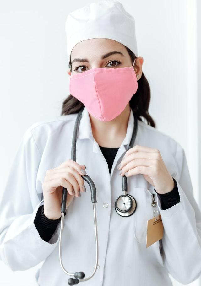 A healthcare worker wearing a mask