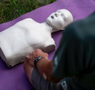 Team practicing AED use during workplace training
