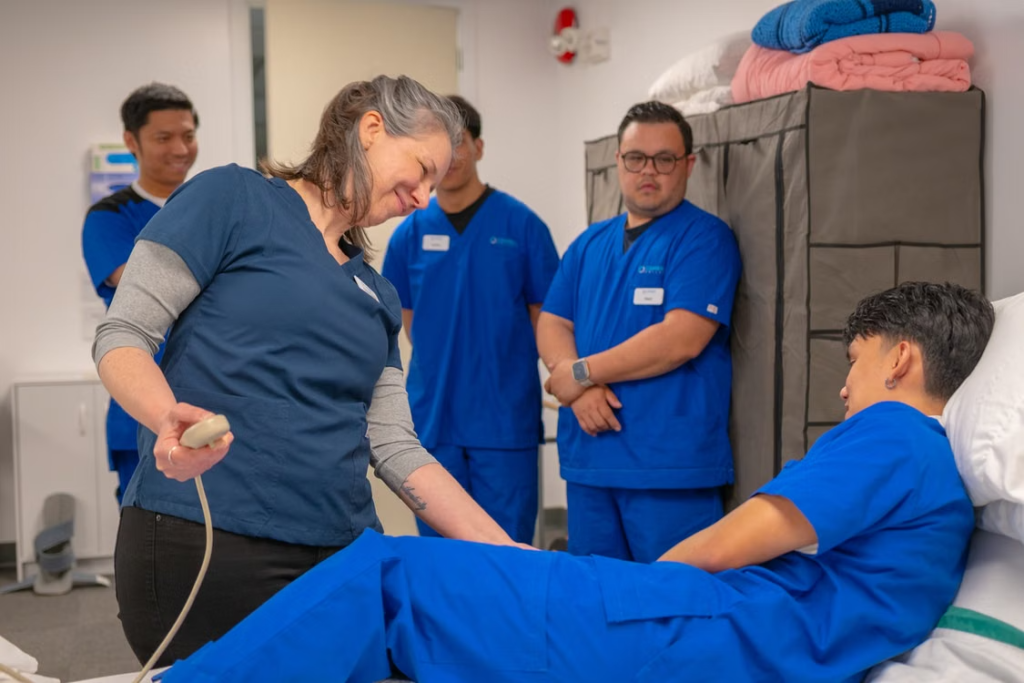 Instructor demonstrating CPR & AED training during a hands-on emergency response class.